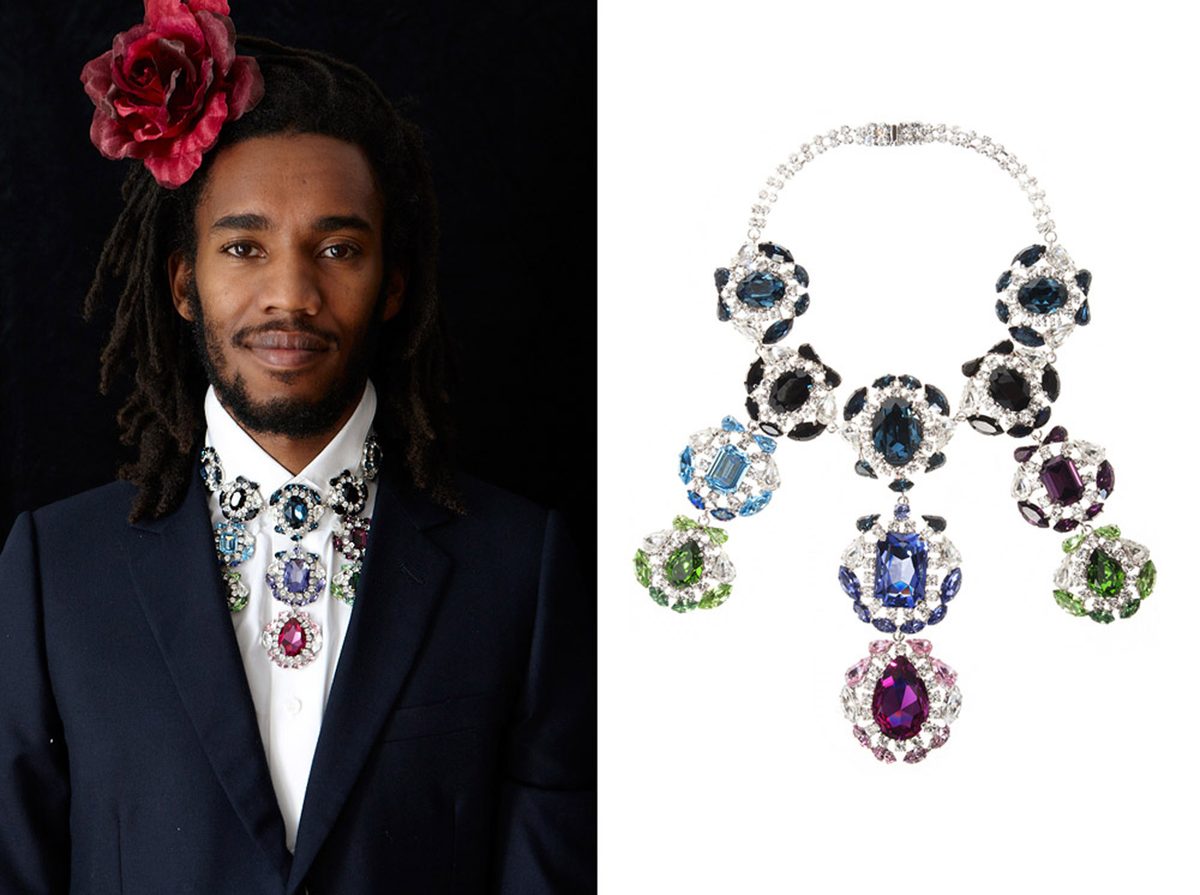 KORMELITZ Autumn/Winter 2012: Swarovski crystal bib necklace in blue, green and purple stones, worn as a collar with a navy suit