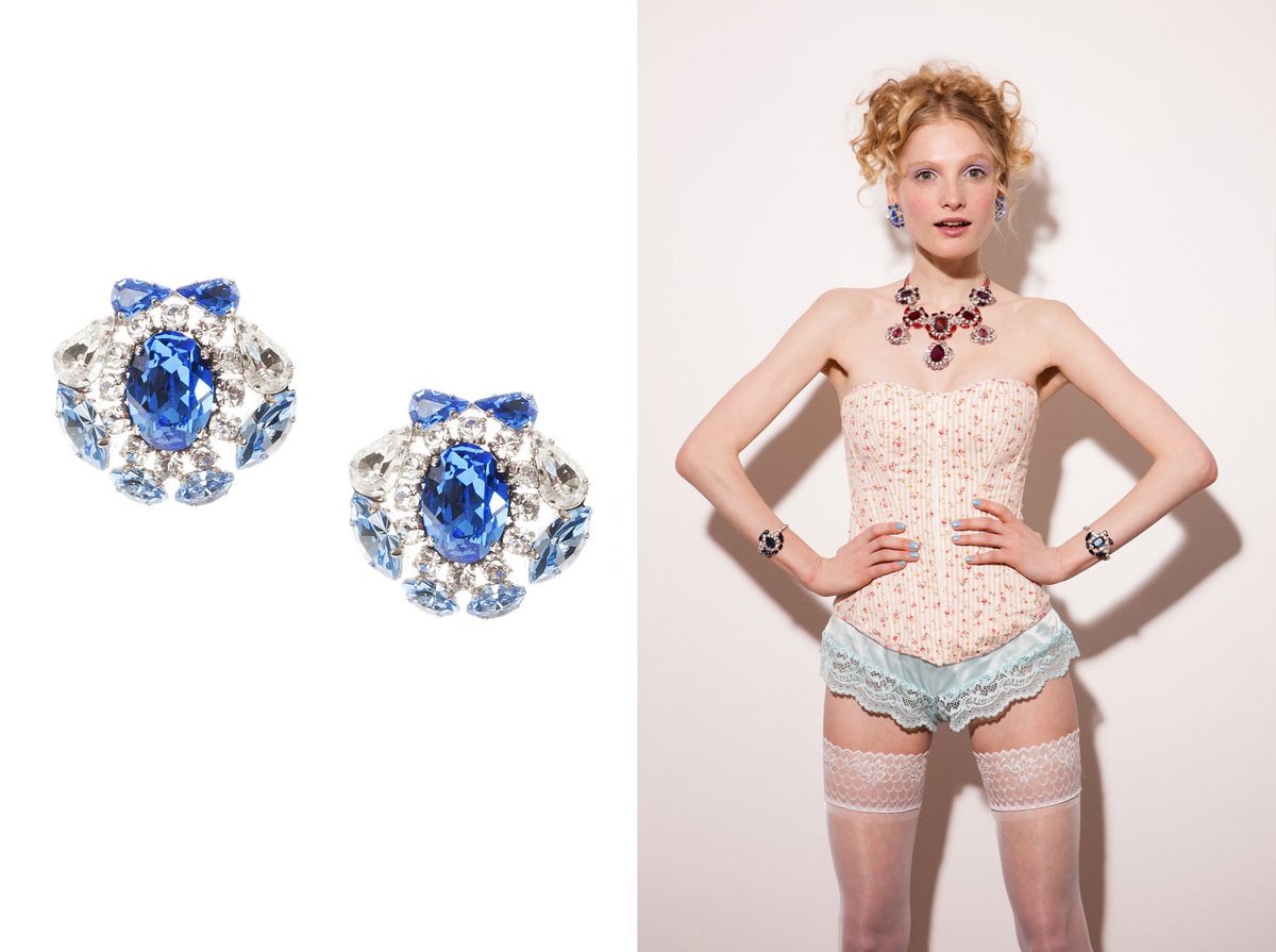 KORMELITZ Spring/Summer 2013: sapphire-blue Swarovski crystal earrings with a bow detail, worn with a lace corset