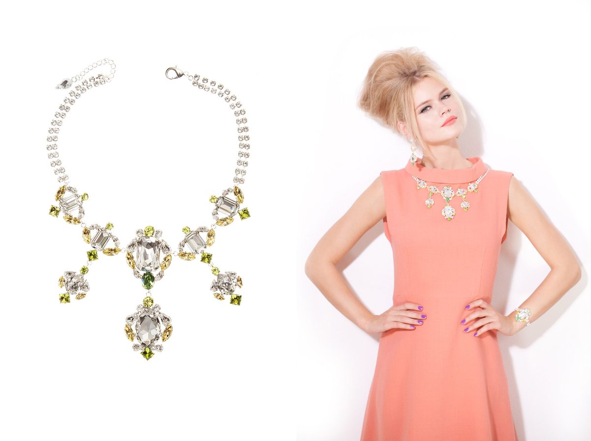 KORMELITZ Autumn/Winter 2013: statement necklace in clear and peridot Swarovski crystal, worn with a coral shift dress